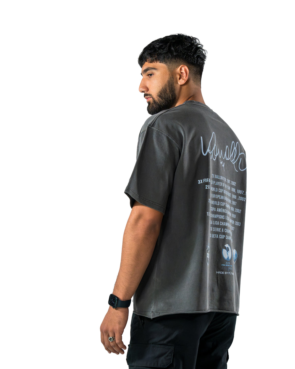Model wearing dark R9 Ronaldo Signature T-shirt, back view by MADEBYFUTBOL