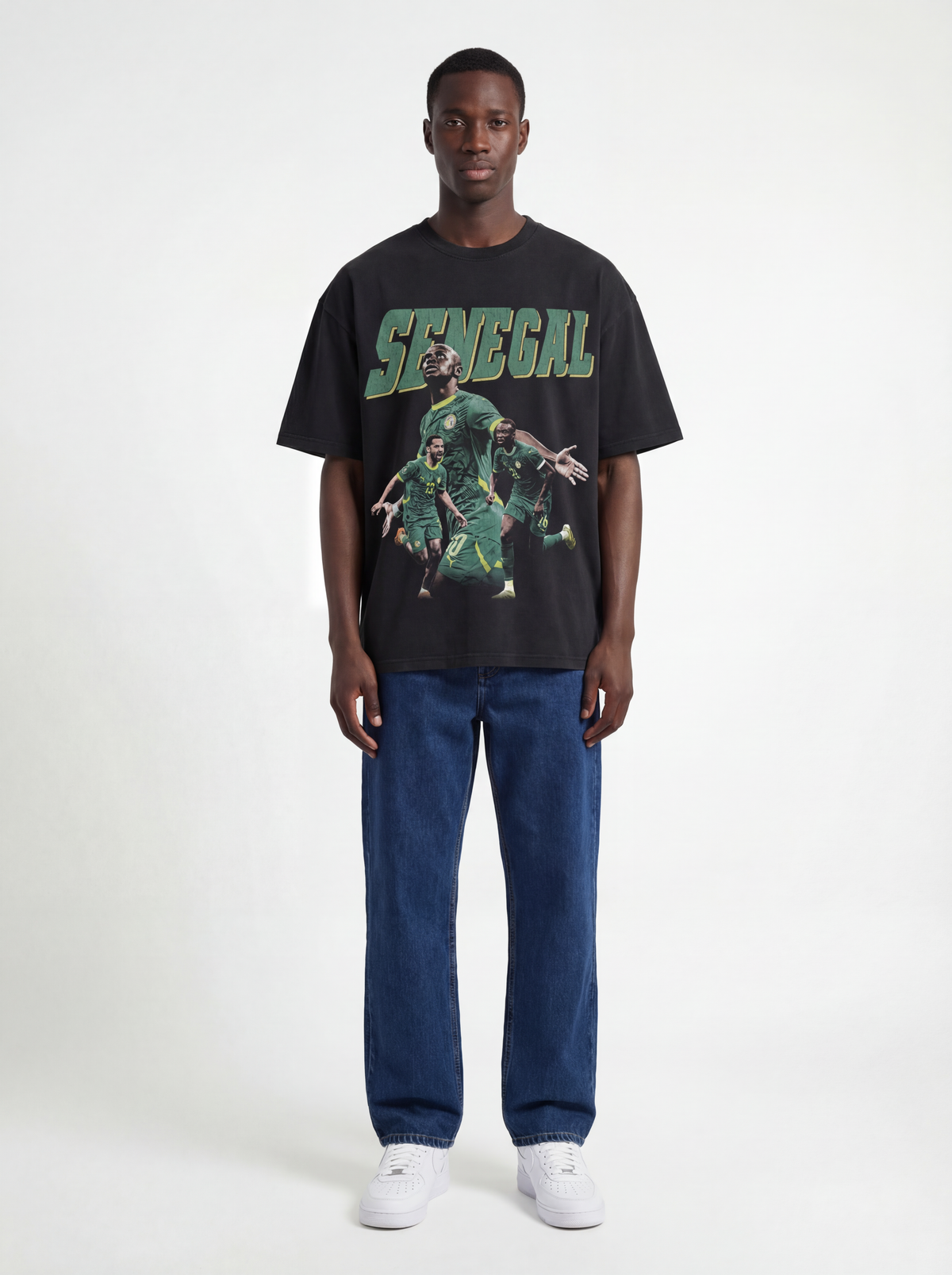 Model wearing black Senegal AFCON graphic T-shirt by MADEBYFUTBOL