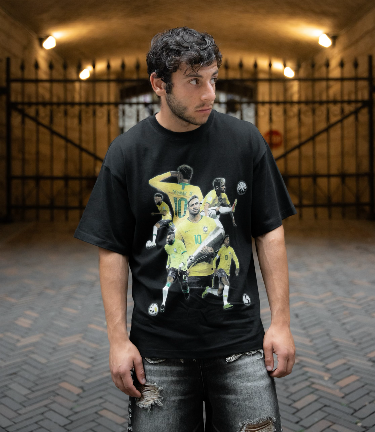 Model wearing black Neymar Brazil graphic T-shirt by MADEBYFUTBOL