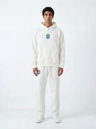 Model wearing white Brazil hoodie and matching sweatpants by MADEBYFUTBOL